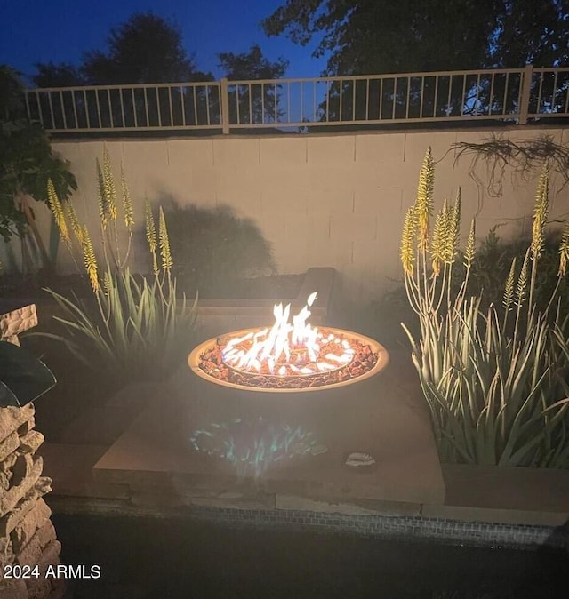 exterior details with a fire pit