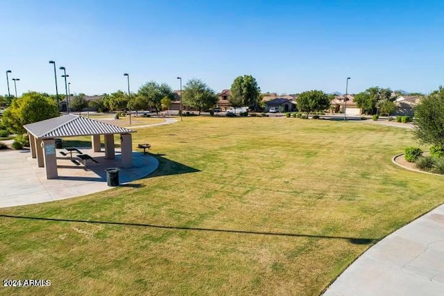 view of property's community with a gazebo and a lawn