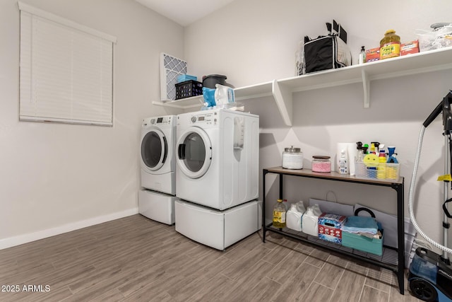 laundry room featuring washing machine and clothes dryer