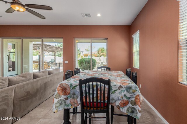 dining room with ceiling fan and light tile patterned floors