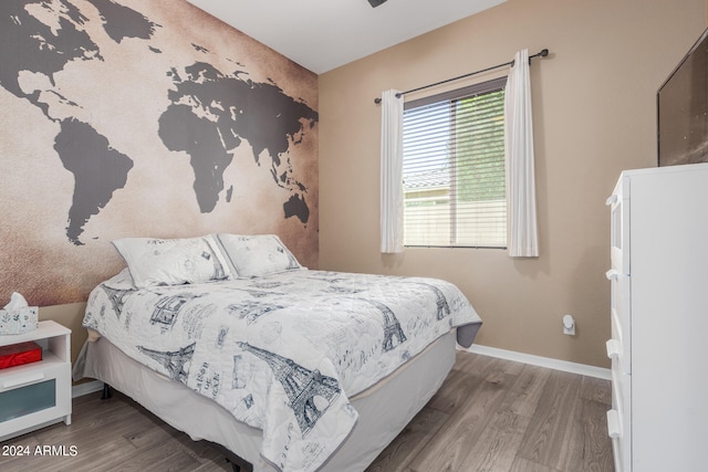 bedroom with wood-type flooring