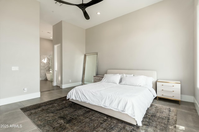 bedroom with ensuite bath and ceiling fan