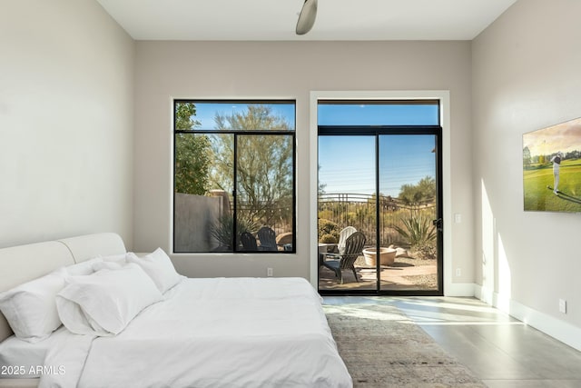 bedroom with access to outside and ceiling fan