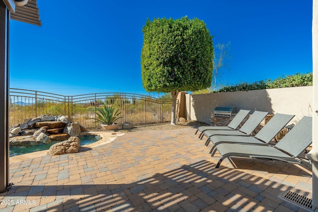 view of patio featuring an outdoor kitchen