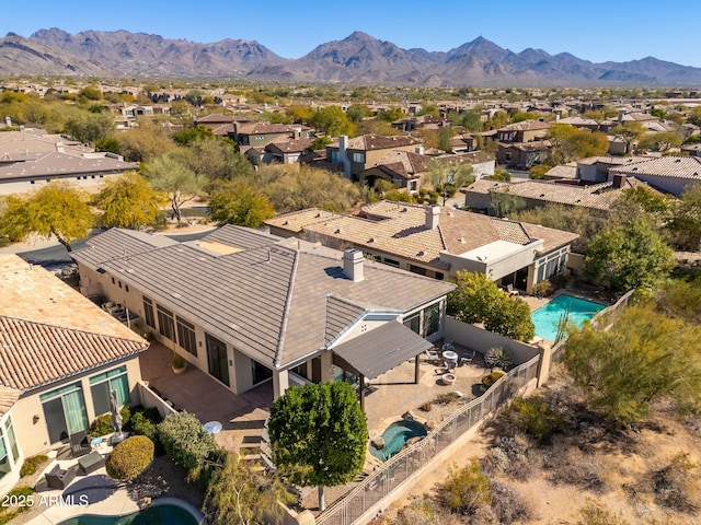 birds eye view of property with a mountain view