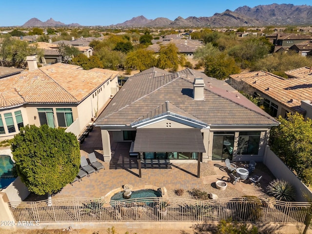 birds eye view of property with a mountain view