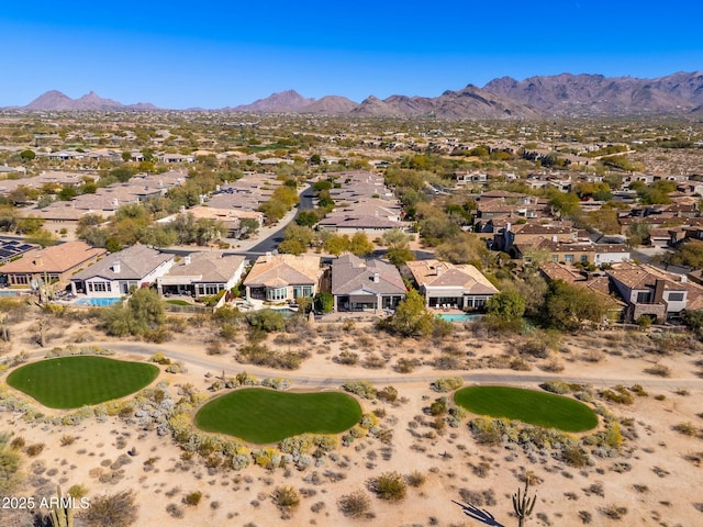 birds eye view of property featuring a mountain view