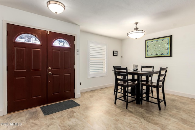 entrance foyer featuring baseboards