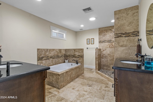 bathroom featuring vanity and separate shower and tub