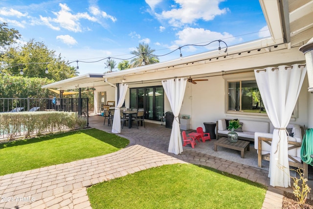 back of house featuring a patio and a yard