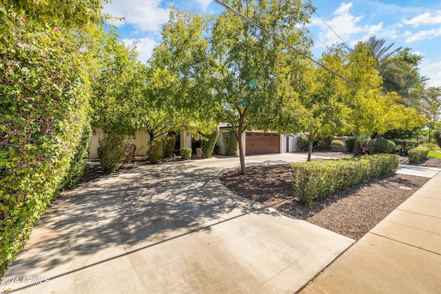 obstructed view of property featuring a garage