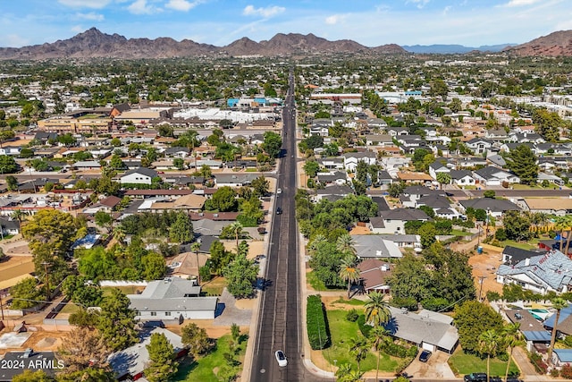 birds eye view of property with a mountain view