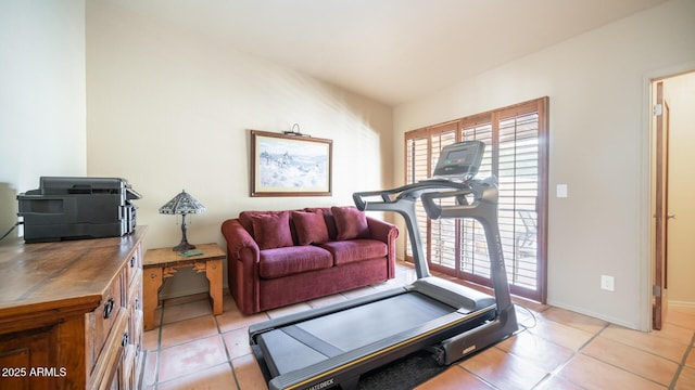 workout room featuring light tile patterned floors