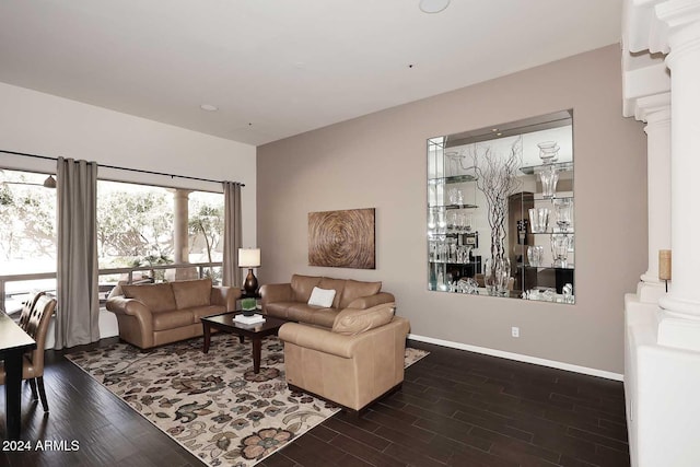 living room with dark hardwood / wood-style flooring