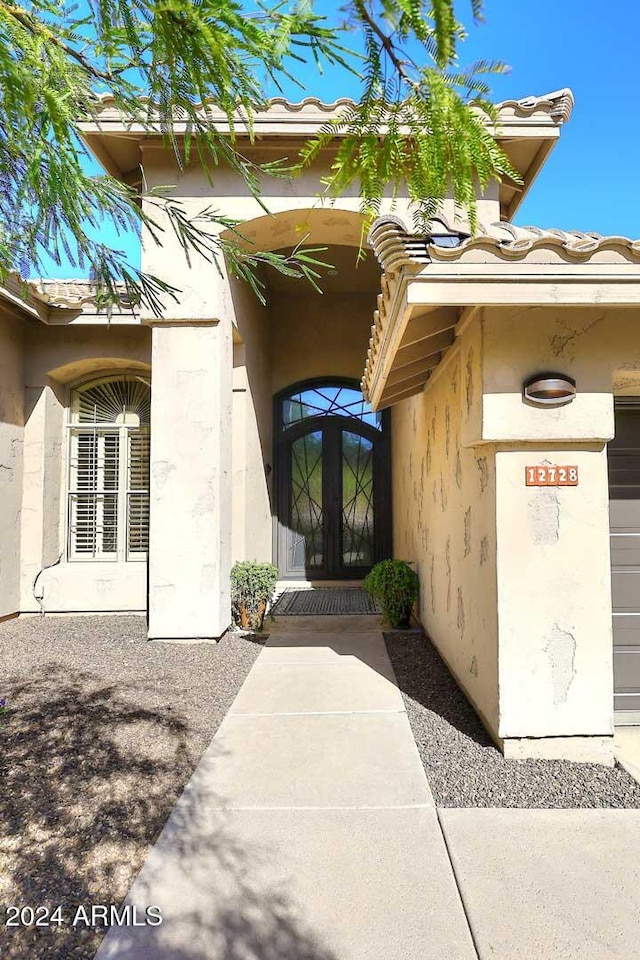 property entrance featuring french doors