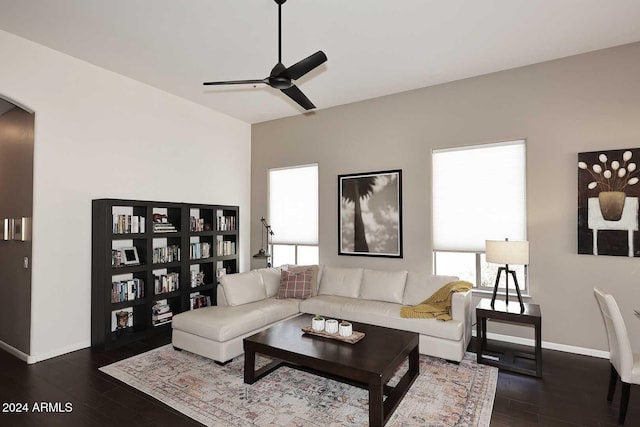 living room featuring dark hardwood / wood-style floors and ceiling fan