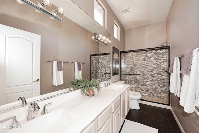 bathroom featuring vanity, toilet, and wood-type flooring