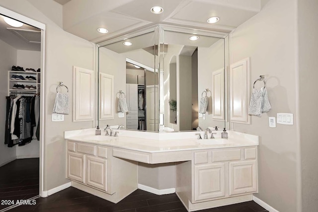 bathroom with hardwood / wood-style floors and vanity