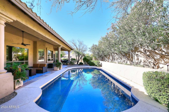 view of pool featuring ceiling fan and a patio