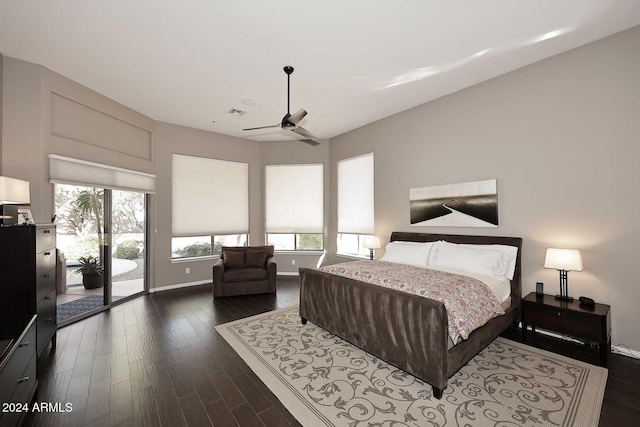 bedroom with ceiling fan, access to exterior, and dark wood-type flooring