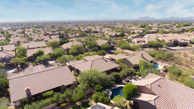 birds eye view of property featuring a mountain view