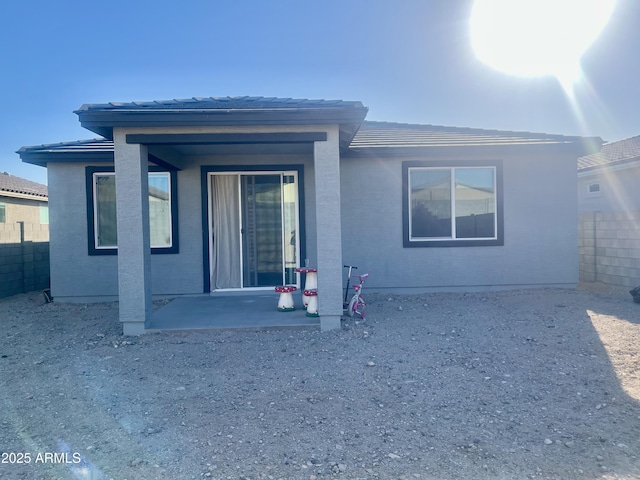 back of house featuring a patio