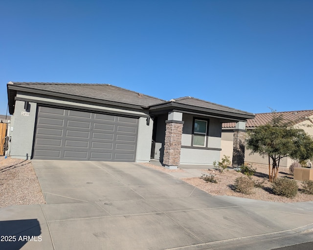 prairie-style home featuring a garage