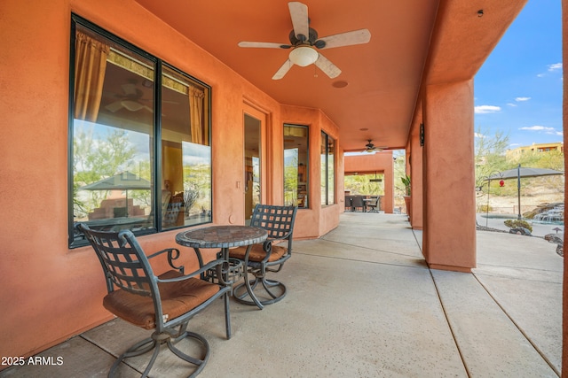 view of patio with ceiling fan