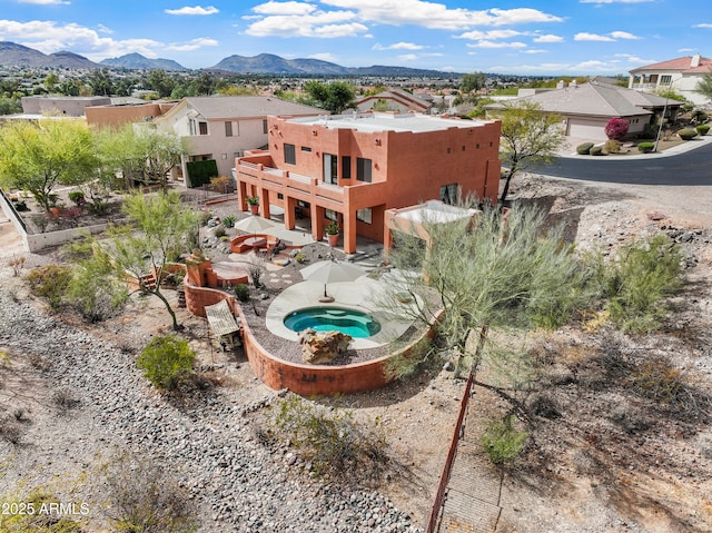 birds eye view of property featuring a mountain view