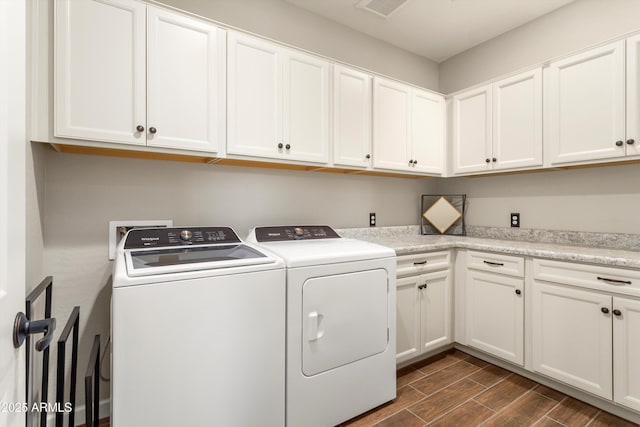 20684 W Meadowbrook Ave, Buckeye, AZ 85396 - laundry room featuring washer and dryer, dark wood-type flooring, and cabinet space