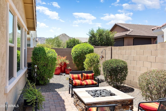 20684 W Meadowbrook Ave, Buckeye, AZ 85396 - fenced backyard featuring an outdoor fire pit and a patio
