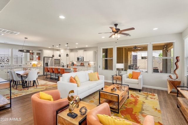 20684 W Meadowbrook Ave, Buckeye, AZ 85396 - living area with wood finished floors, ceiling fan, and recessed lighting