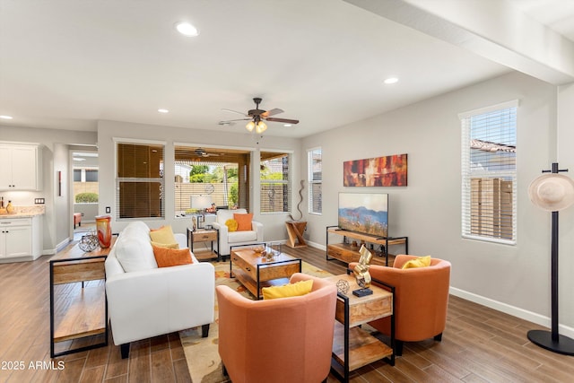 20684 W Meadowbrook Ave, Buckeye, AZ 85396 - living area featuring recessed lighting, wood finished floors, healthy amount of natural light, and a ceiling fan