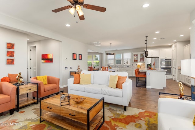 20684 W Meadowbrook Ave, Buckeye, AZ 85396 - living area with recessed lighting, light wood-type flooring, and a ceiling fan