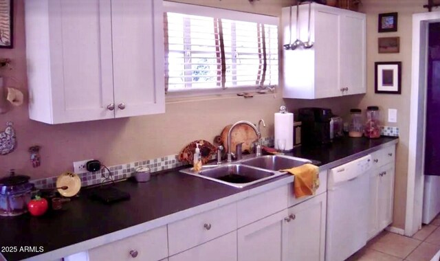 1837 W Roma Ave, Phoenix, AZ 85015 - kitchen featuring white dishwasher, white cabinetry, a sink, and light tile patterned floors