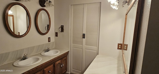 full bath featuring double vanity and a sink