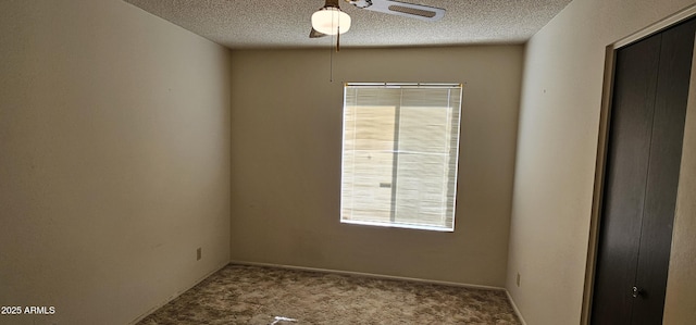 unfurnished room featuring carpet floors, a textured ceiling, and ceiling fan