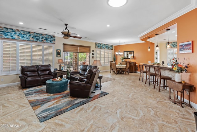 living room featuring crown molding and ceiling fan