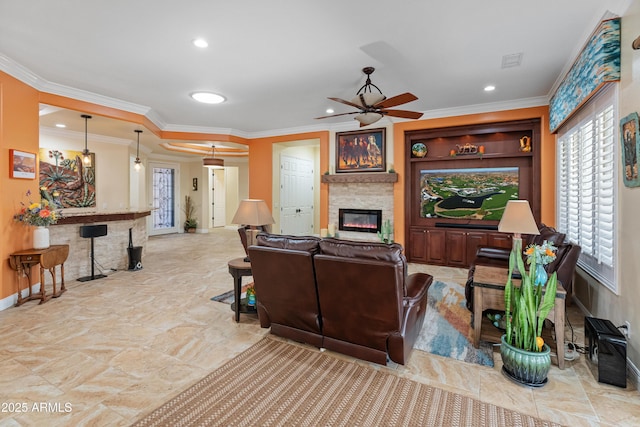 living room featuring crown molding and ceiling fan