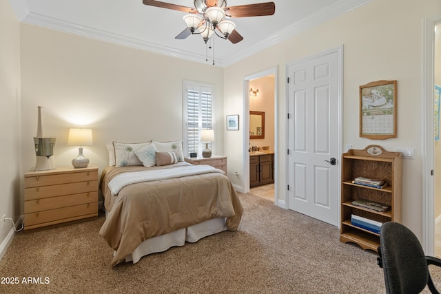 carpeted bedroom featuring crown molding, ensuite bath, and ceiling fan