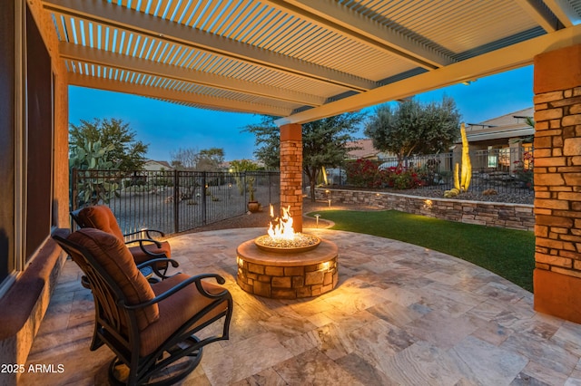 patio terrace at dusk with a pergola and a fire pit