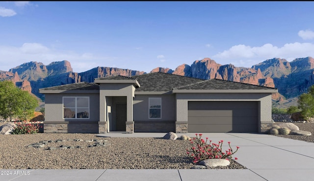 view of front of house with a mountain view and a garage