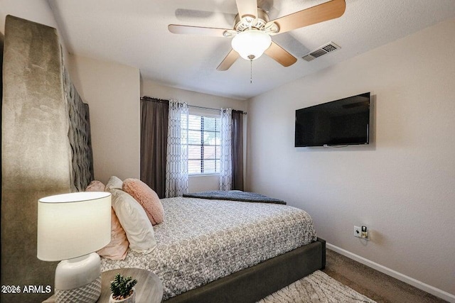 bedroom with ceiling fan and carpet