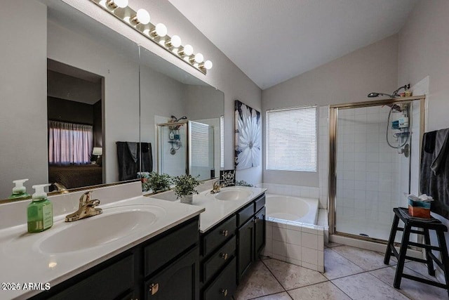 bathroom featuring tile patterned floors, shower with separate bathtub, vanity, and vaulted ceiling