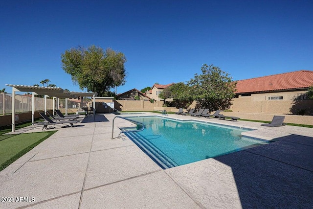 view of swimming pool with a patio area and a pergola