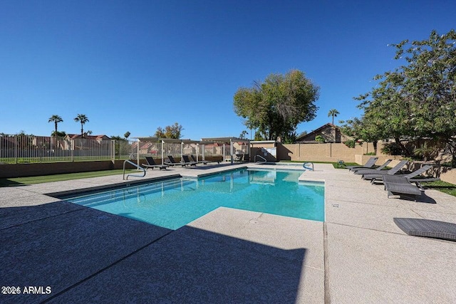 view of swimming pool with a patio