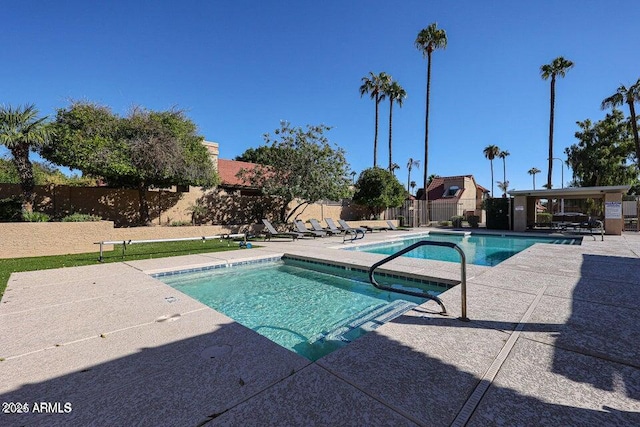 view of swimming pool featuring a patio area