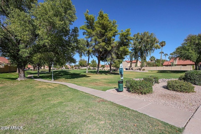 view of home's community with a yard