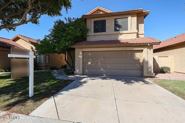 mediterranean / spanish house featuring a garage