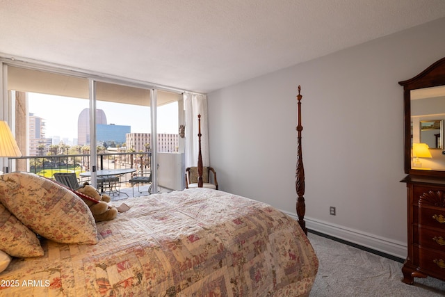 carpeted bedroom with expansive windows and access to outside